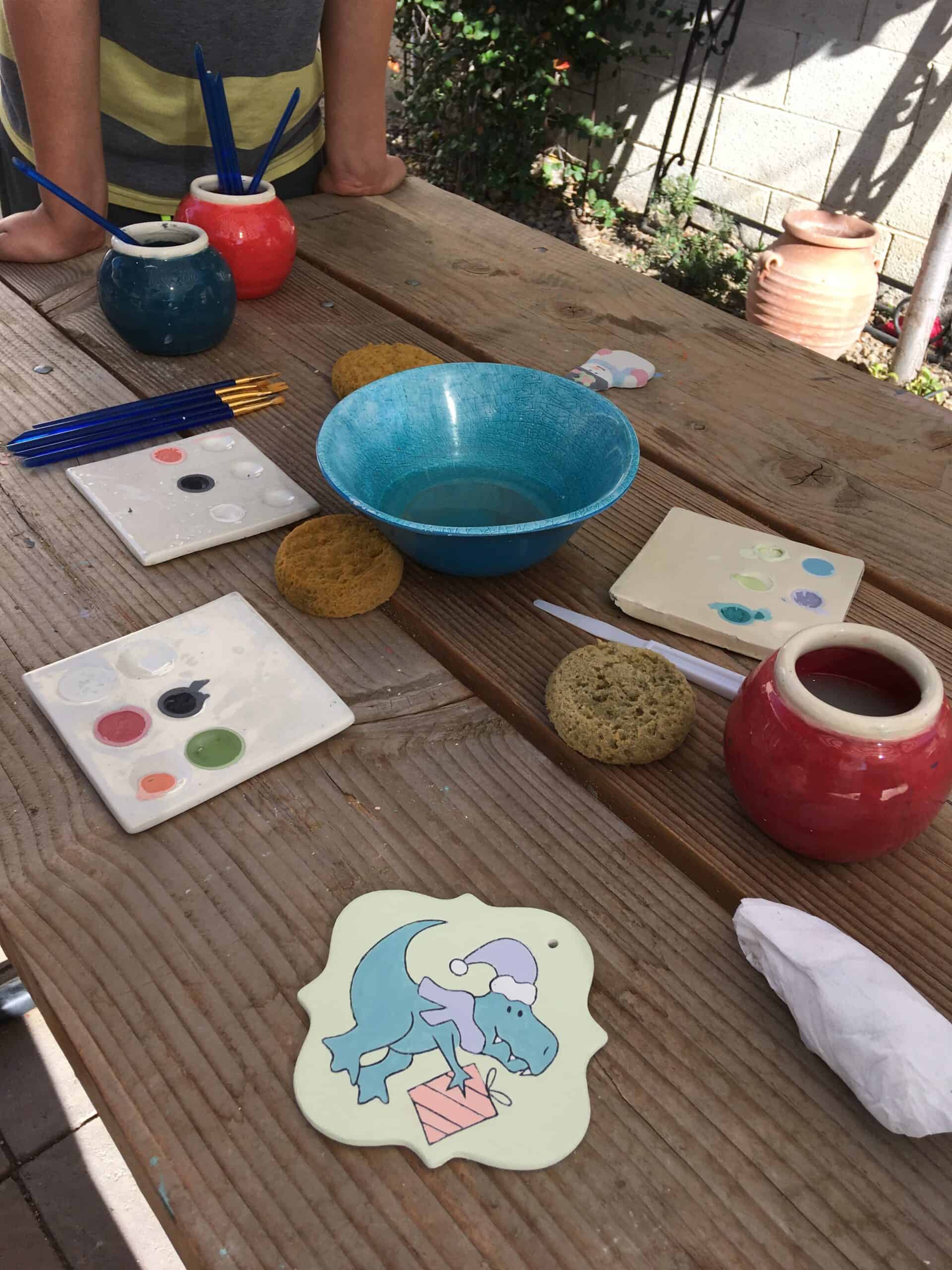 photo of tools to paint pottery on a table