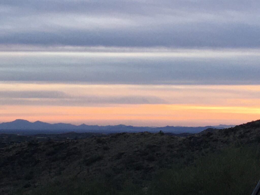 photo of sunset behind mountains