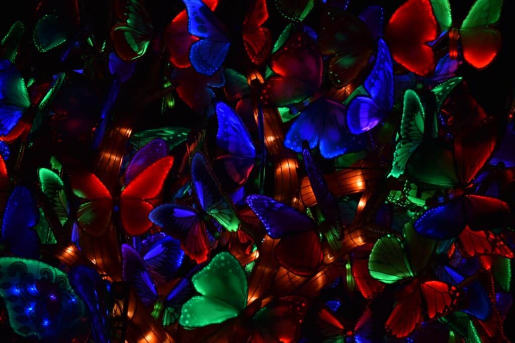 photo of dozens of overlapping butterfly lanterns in several colors