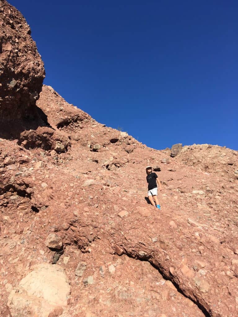 photo of Rocket Kid climbing up some of the previously-pictured rock formations